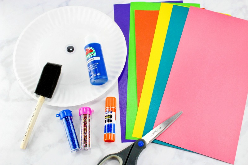 Learn how to make a colorful Paper Plate Fish Craft with a couple simple supplies. This easy craft is perfect for ocean theme activities and kids of all ages. Add this Rainbow Fish Craft for your Under the Sea Preschool Theme