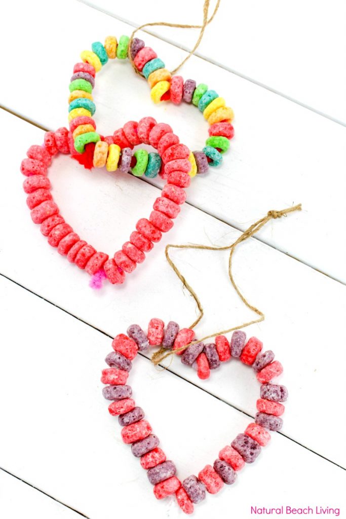 Easy Kid Made Bird Feeder Ornaments Everyone Loves, Heart Bird Treats, Heart bird feeder ornaments, Perfect Valentine's Day activity for kids, Easy Homemade Bird Feeder Ornaments, This is a great winter activity for kids, Birdseed ornaments, DIY Bird Feeder for kids to make, Nature activities for kids, How to Make Bird Treats, How to Make Bird Feeder Ornaments with Kids, Birdseed Ornaments Recipe #birdseedornaments #Birdtreats #homemadebirdfeeders #birds #bird