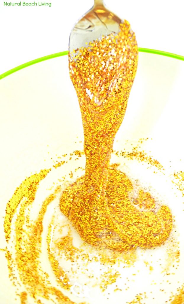 How to Make Slime Recipe with Contact Solution Perfect for St. Patrick's Day Sensory Play. This Awesome Gold Glitter Contact Solution Slime Recipe is a super easy Homemade slime recipe. Find The Best Slime Recipes here!