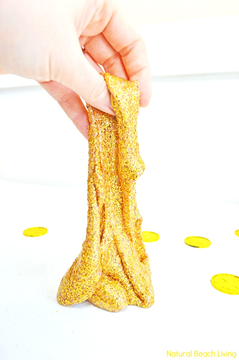 Learn How to Make Slime Recipe with Contact Solution Perfect for St. Patrick's Day Sensory play. This Awesome Gold Glitter Contact Solution Slime Recipe is a super easy  Homemade slime recipe. Find The Best Slime Recipes here.