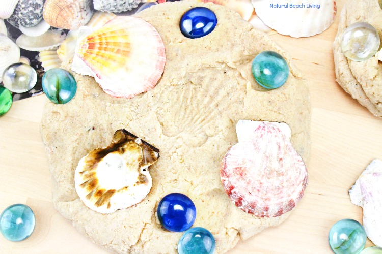 Kids love making imprints of the seashells on this sand playdough. Make DIY Sand Play dough for a perfect Beach Theme Playdough recipe, this Textured Playdough is fun sensory play and summer activity #sensoryplay #playdough #sandplaydough #preschool #toddlers #beachtheme Kids love making imprints of the seashells on this sand playdough. Make DIY Sand Play dough for a perfect Beach Theme Playdough recipe, this Textured Playdough is fun sensory play and summer activity