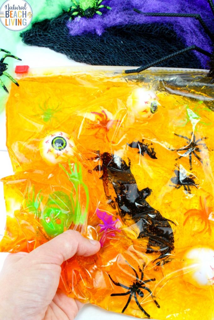 An easy Halloween Sensory Bag, Sensory play for babies, toddlers, and preschoolers, The Benefits of sensory Bags and How to Make Halloween Sensory Bags, Mess Free Halloween Sensory Activities for exploring senses. Sensory Play for Babies