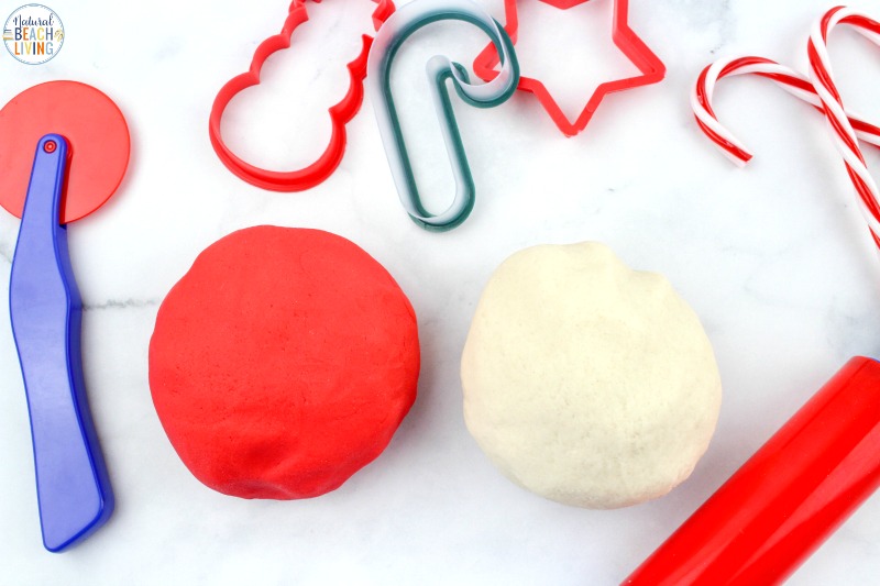 This Candy Cane Playdough recipe is so much fun! Peppermint Playdough smells great and looks just like a candy cane once it's created and ready! Gather up your playdough supplies and great ready to make a truly awesome Scented Playdough. Homemade Playdough for Christmas