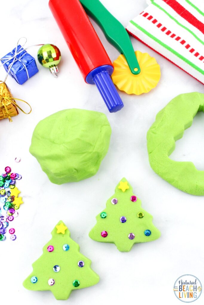 You're going to want to add this Christmas Playdough to your holiday activities!  This Homemade Playdough is easy to make and using Christmas Playdough cutters is a lot of fun!  How to make playdough from gingerbread playdough to peppermint to cranberry to snow dough and more, it's all here!