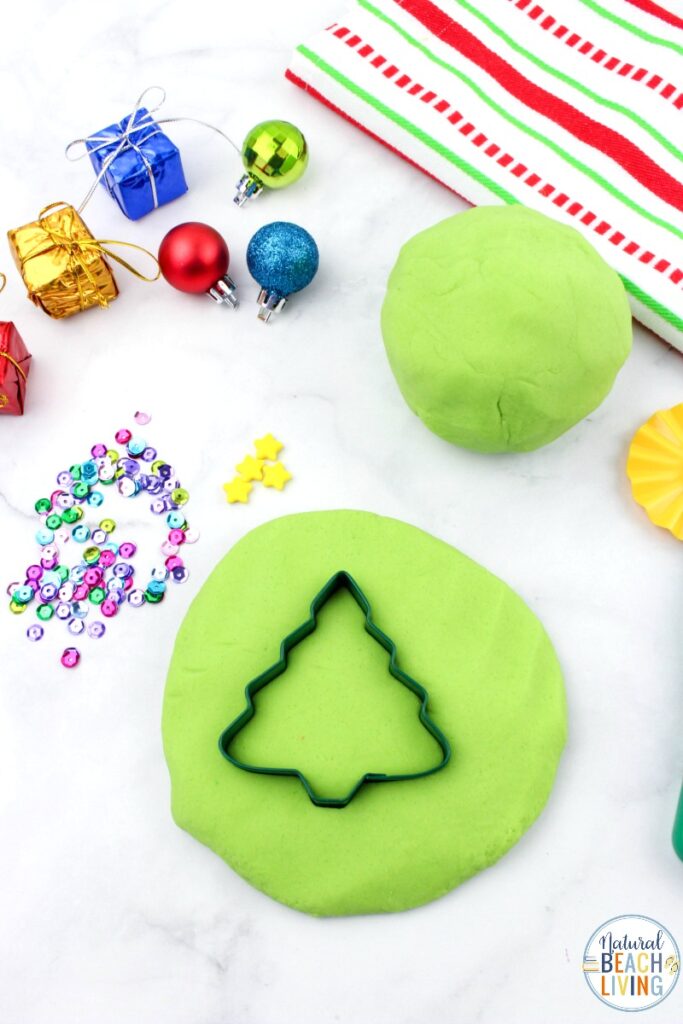 You're going to want to add this Christmas Playdough to your holiday activities!  This Homemade Playdough is easy to make and using Christmas Playdough cutters is a lot of fun!  How to make playdough from gingerbread playdough to peppermint to cranberry to snow dough and more, it's all here!