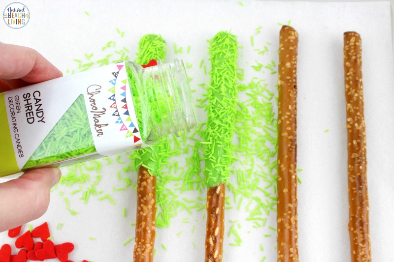 These delicious Grinch Chocolate Covered Pretzels will make everyone happy. They are so easy to make and Grinch Food Recipes look great on a party table. Add these Grinch Chocolate Covered Pretzels to your Grinch Food list and pull off a marvelous movie night or holiday party, Chocolate dipped pretzels, Grinch Party Ideas