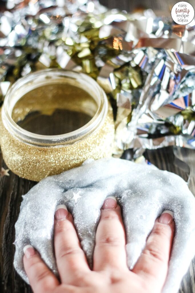 You're going to love the ease of this New Years Eve Slime! It's a simple clear slime recipe that will have everyone celebrating in the New Year fun!  Plus, your children can create a fun Glitter Craft Jar to put their slime in. This DIY slime recipe makes the Perfect Party Slime! 