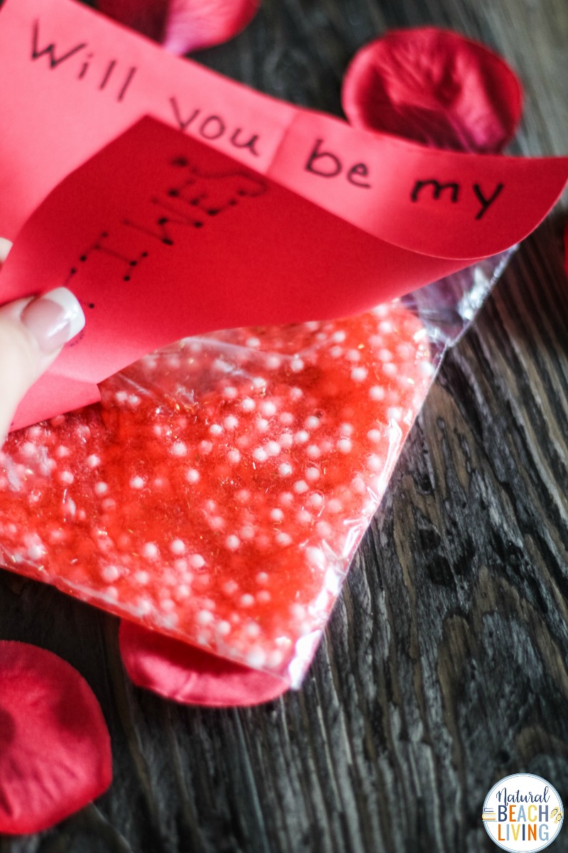 This Valentines Day Slime Card is so simple and easy to make. Plus, it's a unique Valentines Day Slime Recipe and easy Valentine Crafts for Preschoolers. This Valentine's Day Floam Slime is an awesome sensory activity and a super cool Kid Valentine Card, Use this Valentine Craft idea for a Preschool Valentine Theme Kids Love!