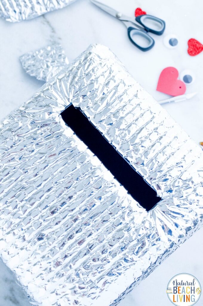 This Robot Valentine Box is so much fun! A super cute Valentine's Day Card Box that you can easily make with recycled materials? Your kids will love this DIY Robot Valentine Box, Gather up your supplies and get ready to have fun creating this DIY robot!