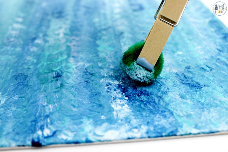 You'll love this Ocean Art Preschool Activity! It's a great way to talk about the ocean and be creative at the same time. A simple art activity that teaches painting with different textures, shades of blues, makes a great Earth Day Art or any under the sea theme idea. Process art is always a great activity to include into your preschoolers day.