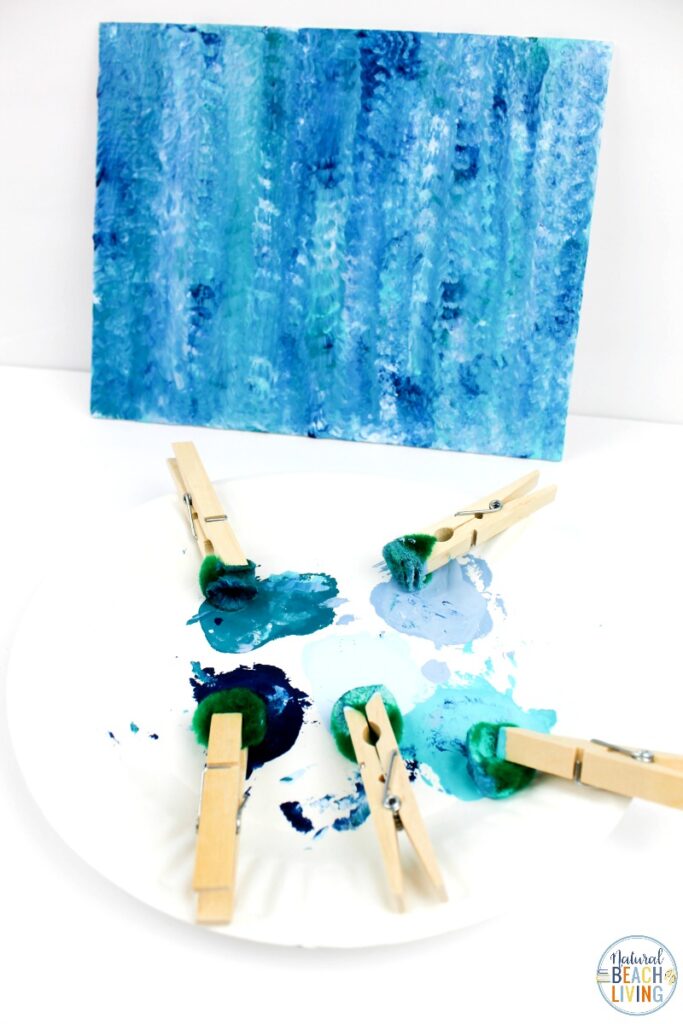 You'll love this Ocean Art Preschool Activity! It's a great way to talk about the ocean and be creative at the same time. A simple art activity that teaches painting with different textures, shades of blues, makes a great Earth Day Art or any under the sea theme idea. Process art is always a great activity to include into your preschoolers day.