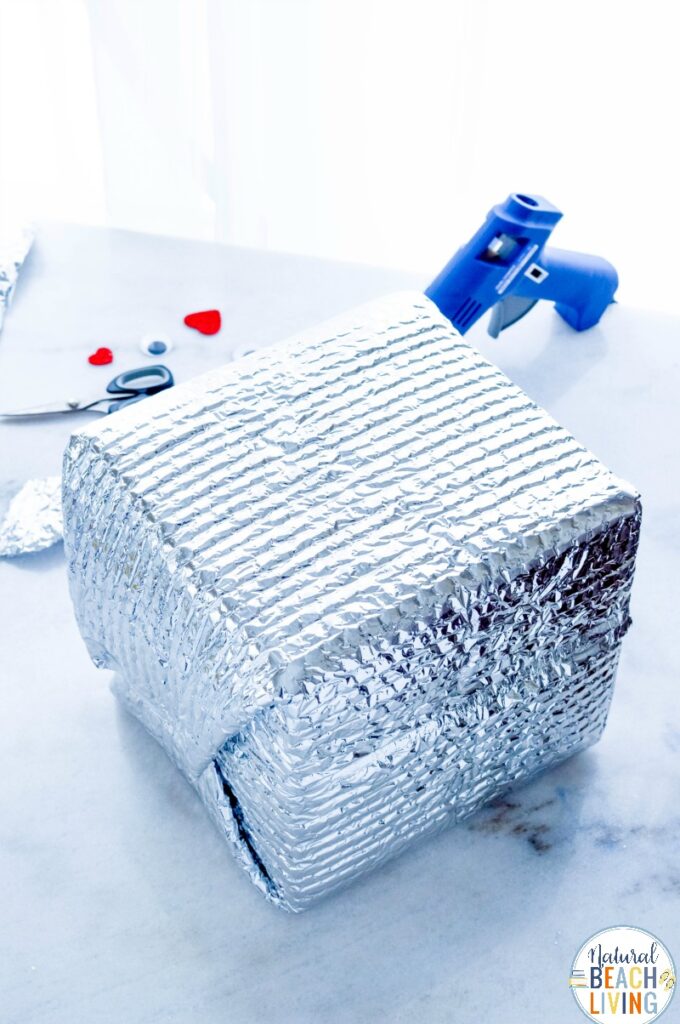 This Robot Valentine Box is so much fun! A super cute Valentine's Day Card Box that you can easily make with recycled materials? Your kids will love this DIY Robot Valentine Box, Gather up your supplies and get ready to have fun creating this DIY robot!
