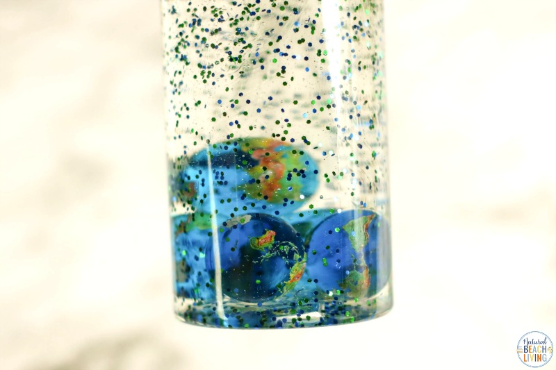 Make these Earth Day Sensory Bottles to enjoy simple science concepts with toddlers and preschoolers. Easy to make Earth Discovery Bottles to add to your Earth Day Activities. Sensory Bottles are a great calming tool for children of all ages.