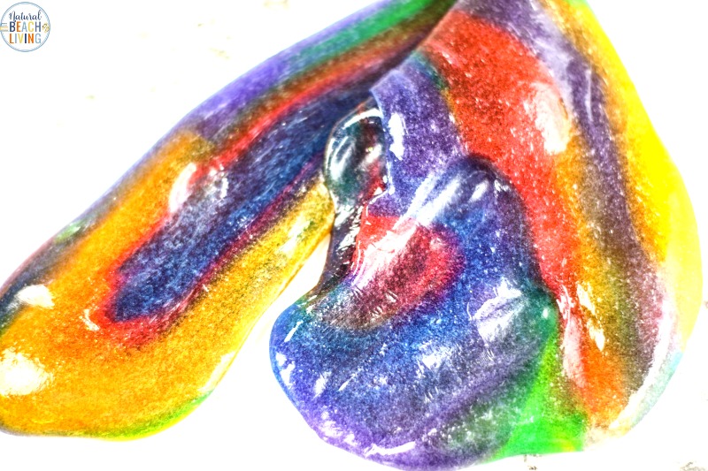 This Rainbow Slime is so much fun to make! This Rainbow Slime Recipe with Contact Solution is bright, stretchy, and amazing. Your child is going to love playing with this Easy Slime Recipe. Make this slime for a fun spring or summer activity or a unicorn or rainbow theme birthday party. It's Perfect! 