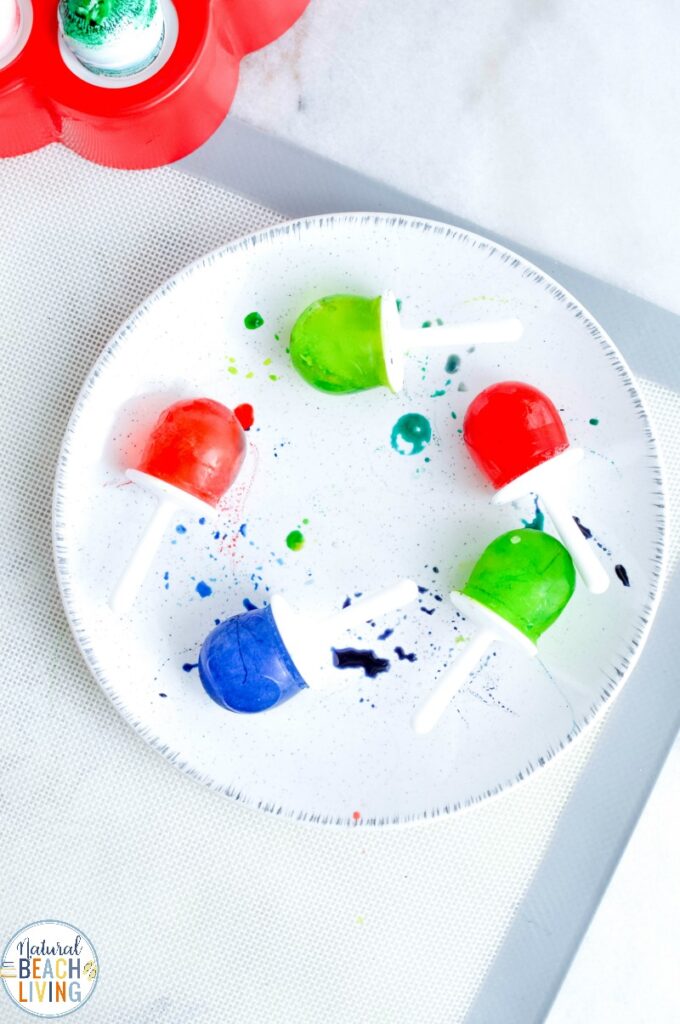 This Ice Cube Painting is so much fun for kids and only takes 2 ingredients. You're going to love watching the kids be creative with their Rainbow Ice Paint. A Summer Art Activity and sensory idea perfect for toddlers and preschoolers 