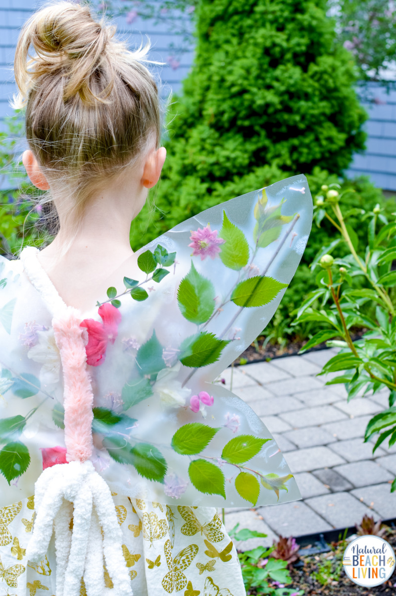 Look at these lovely Flower Butterfly Wings; This is THE BEST Nature Craft, How to make your own DIY butterfly wings for kids from flowers, A fun and easy DIY Flower Fairy Craft for kids. Perfect for Forest School or even a DIY Halloween Costume.