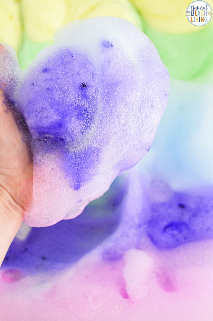 Make magical rainbow soap foam with kids! This easy homemade sensory play recipe is perfect for toddlers & preschoolers. Simple, fun & colorful!
