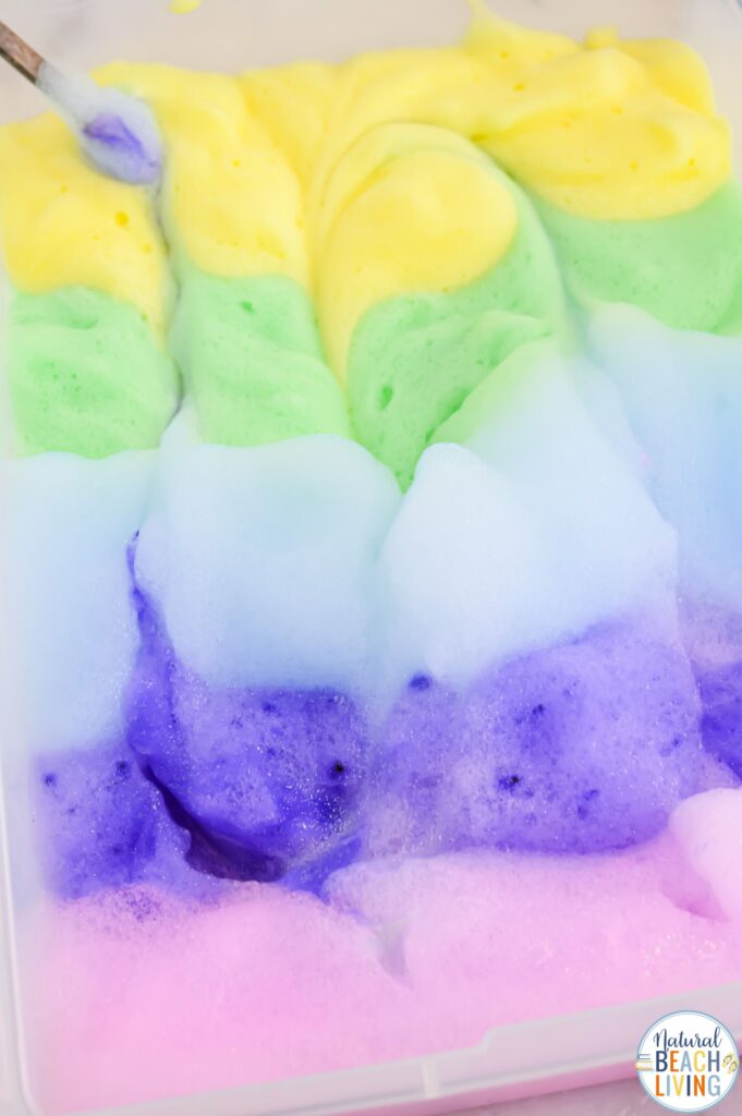 Make magical rainbow soap foam with kids! This easy homemade sensory play recipe is perfect for toddlers & preschoolers. Simple, fun & colorful!